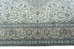 Corner detail of 2000s Kashan rug showing border pattern and Wool pile