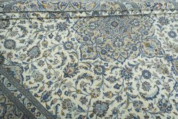 Close-up detail of 2000s Kashan rug from Iran / Persia showing Wool weave
