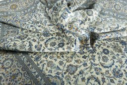 Surface texture of 2000s Kashan rug with natural Wool and intricate pattern