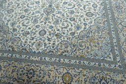Close-up detail of 2000s Kashan rug from Iran / Persia showing Wool weave