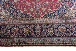 Full view of 1950s Kashan rug from Iran / Persia, 366 × 243 cm in Red tones