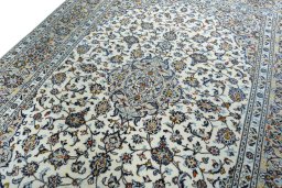 Backside of handmade 2000s Kashan rug showing knot structure and weave density