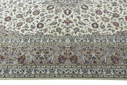 Corner detail of 2000s Kashan rug showing border pattern and Wool pile