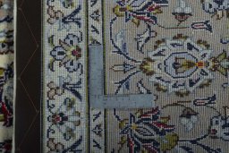Close-up detail of 2000s Kashan rug from Iran / Persia showing Wool weave