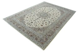 Corner detail of 2000s Kashan rug showing border pattern and Wool pile