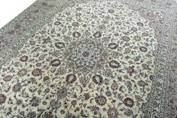 Backside of handmade 2000s Kashan rug showing knot structure and weave density