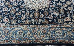 Corner detail of 1970s Kashan rug showing border pattern and Wool pile