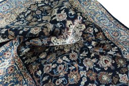 Surface texture of 1970s Kashan rug with natural Wool and intricate pattern