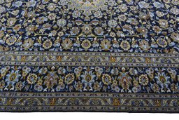 Corner detail of 2000s Kashan rug showing border pattern and Wool pile