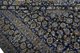 Close-up detail of 2000s Kashan rug from Iran / Persia showing Wool weave