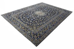 Corner detail of 2000s Kashan rug showing border pattern and Wool pile