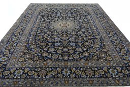 Surface texture of 2000s Kashan rug with natural Wool and intricate pattern