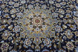 Central medallion detail of 2000s Kashan rug from Iran / Persia