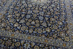 Close-up detail of 2000s Kashan rug from Iran / Persia showing Wool weave