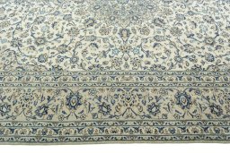Corner detail of 2000s Kashan rug showing border pattern and Wool pile