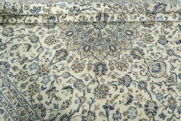 Close-up detail of 2000s Kashan rug from Iran / Persia showing Wool weave