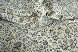 Surface texture of 2000s Kashan rug with natural Wool and intricate pattern