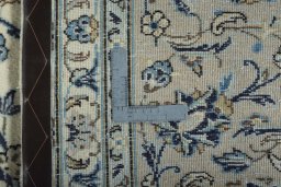 Backside of handmade 2000s Kashan rug showing knot structure and weave density