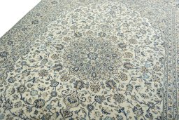 Backside of handmade 2000s Kashan rug showing knot structure and weave density