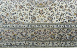 Corner detail of 2000s Kashan rug showing border pattern and Wool pile