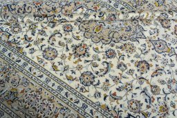 Close-up detail of 2000s Kashan rug from Iran / Persia showing Wool weave