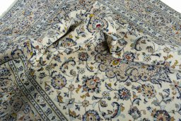 Surface texture of 2000s Kashan rug with natural Wool and intricate pattern