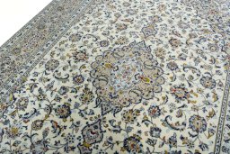 Backside of handmade 2000s Kashan rug showing knot structure and weave density