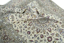 Surface texture of 2000s Kashan rug with natural Wool and intricate pattern