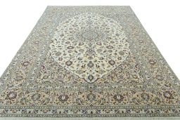 Surface texture of 2000s Kashan rug with natural Wool and intricate pattern