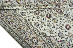 Close-up detail of 2000s Kashan rug from Iran / Persia showing Wool weave