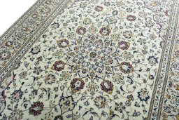 Backside of handmade 2000s Kashan rug showing knot structure and weave density
