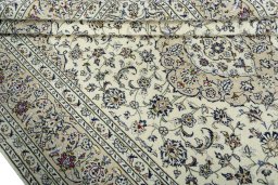 Close-up detail of 2000s Kashan rug from Iran / Persia showing Wool weave