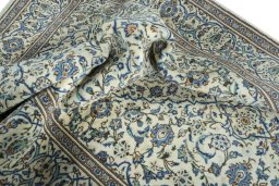 Surface texture of 2000s Kashan rug with natural Wool and intricate pattern