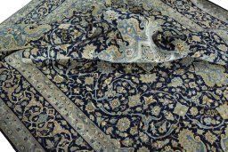 Surface texture of 2000s Kashan rug with natural Cork and intricate pattern