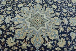 Central medallion detail of 2000s Kashan rug from Iran / Persia