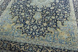 Close-up detail of 2000s Kashan rug from Iran / Persia showing Cork weave