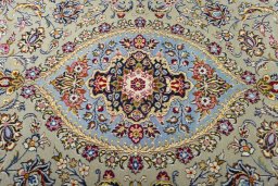 Central medallion detail of 2000s Kashan rug from Iran / Persia