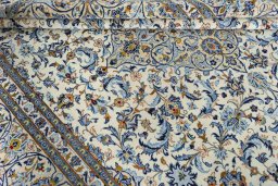 Close-up detail of 2000s Kashan rug from Iran / Persia showing Wool weave
