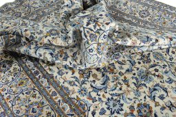 Surface texture of 2000s Kashan rug with natural Wool and intricate pattern