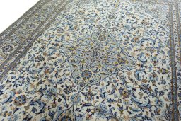 Backside of handmade 2000s Kashan rug showing knot structure and weave density