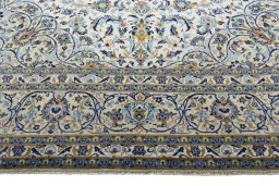 Full view of 2000s Kashan rug from Iran / Persia, 415 × 300 cm in Beige tones