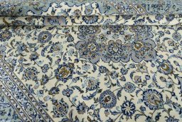 Close-up detail of 2000s Kashan rug from Iran / Persia showing Wool weave