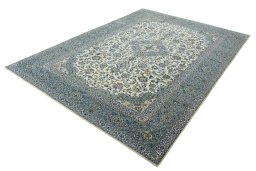 Corner detail of 2000s Kashan rug showing border pattern and Wool pile