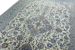 Backside of handmade 2000s Kashan rug showing knot structure and weave density