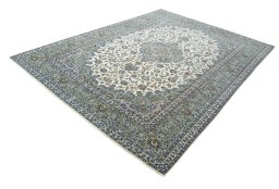 Corner detail of 2000s Kashan rug showing border pattern and Wool pile