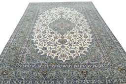 Surface texture of 2000s Kashan rug with natural Wool and intricate pattern