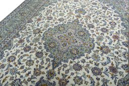Backside of handmade 2000s Kashan rug showing knot structure and weave density