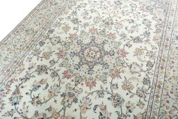 Backside of handmade 2000s Kashan rug showing knot structure and weave density
