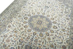 Backside of handmade 2000s Kashan rug showing knot structure and weave density
