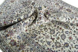 Surface texture of 2000s Kashan rug with natural Wool and intricate pattern